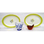 Pair of Susie Cooper oval serving dishes painted with flowers within a marigold yellow border,