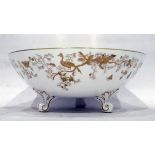 Coalport bowl decorated in gold with exotic birds, on a white ground, on three scrolling feet,