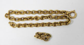 Gold chain link necklace, alternating reeded and twin oval links, with extra section as pendant,