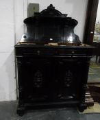 19th century continental ebonised wood side cabinet with carved arched top, shelf back,
