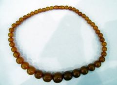 Amber necklace with graduated circular beads,