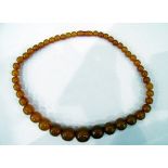 Amber necklace with graduated circular beads,