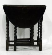 Oak oval-top gateleg table, on turned spiral supports united by stretchers,
