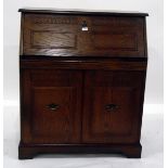20th century oak bureau, the carved fall enclosing pigeonholes and drawer,