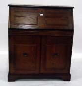 20th century oak bureau, the carved fall enclosing pigeonholes and drawer,