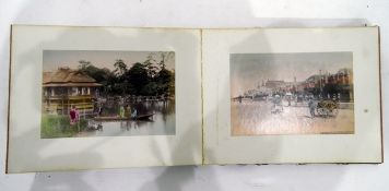 12 coloured photographs of Japan, one titled "Marunouchi Tokyo" in concertina folding book,