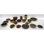 Quantity of Muchelney stoneware items including bowls and dishes of various sizes, a jug, plates,