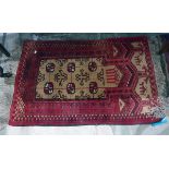 Small Persian wool rug, red ground with cream and black geometric pattern,