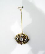 19th century gold(?) and paste set brooch, oval with nine assorted sized paste stones,
