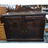 Late Victorian mahogany side cupboard with carved shaped splashback, two frieze drawers,