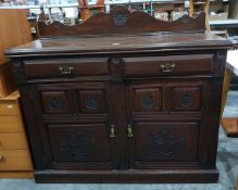 Late Victorian mahogany side cupboard with carved shaped splashback, two frieze drawers,