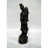 Carved jade figure of a diety holding lotus flower, on plinth base,