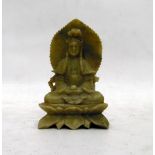 Carved jade figure of a seated deity,