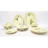 Royal Doulton Art Deco part table service decorated with green and brown scrolls on a cream ground,