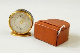 Jaeger eight-day six Swiss travelling alarm clock, circular, in leather case