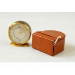 Jaeger eight-day six Swiss travelling alarm clock, circular, in leather case