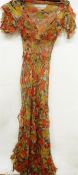1930's silk patterned dress with floating bodice, full-length with tiered frills to the side, a
