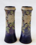 Pair of Royal Doulton tube-lined vases decorated with white roses on a blue ground, no.7816A to