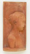 Carved red stone wall plaque depicting an angel, rectangular, 50cm x 25cm