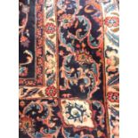 Persian style rug with pink ground, scroll and foliate central medallion, allover floral decorated