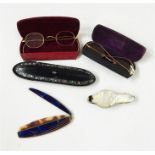 Assorted folding spectacles in cases, a folding tr