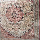 Silk prayer rug showing animals, with a central cartouche, all on a pale rust-coloured ground,