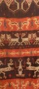 Indonesian Sumba woven hanging, stylised animal and figure decoration in cream and blue to brown and