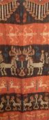 Indonesian Sumba woven hanging, stylised animal and figure motifs, in cream, blue, red and brown,