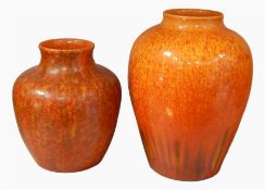 Two Lancastrian vases, orange glaze, marked to base, 20cm high and 15cm high (2)