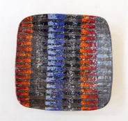 Possibly Scandinavian studio pottery dish, blue, orange, red patterned glaze on a dark ground,