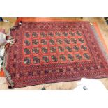 Afghan wool rug, red ground with madder field, elephant foot pattern guls with multiple guard