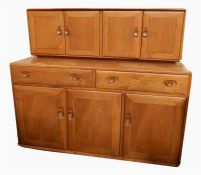 Ercol light elm dresser with pair cupboards to top, two drawers and three cupboards to base, all