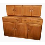 Ercol light elm dresser with pair cupboards to top, two drawers and three cupboards to base, all