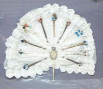 19th century lace bobbins framed around lace to form the shape of a fan, framed and glazed