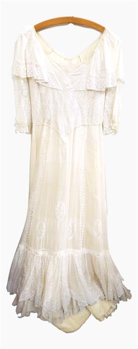 Late Edwardian cream wedding dress with lace bodice, lace panels, all on lawn cotton, satin tie at