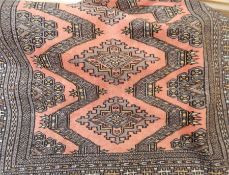 Persian style wool rug, peach ground with lozenge