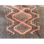 Persian style wool rug, peach ground with lozenge