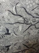 Old Batik black and white fabric panel with decoration of exotic birds and butterflies, on an