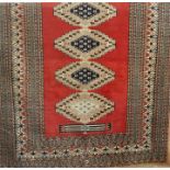 Eastern style rug, red ground with lozenge design