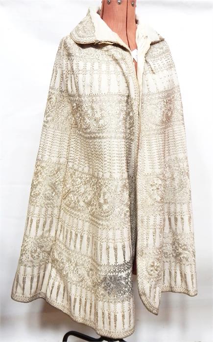 Indian wool cloak heavily embroidered with silver thread, satin lining, with foldover collar