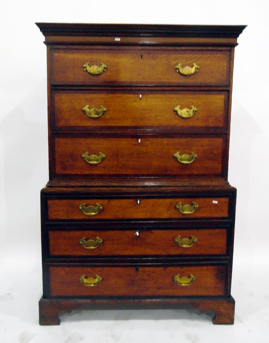 Early 19th century oak and mahogany banded tallboy chest having dentil moulded cornice, over three