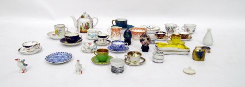 Quantity of miniature china cups and saucers, including Crown Derby and Spode and other miniature