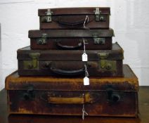 Four various vintage leather suitcases