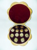 Set of 12 gold-coloured and enamel medallions, each depicting a Chinese Zodiac animal and listing