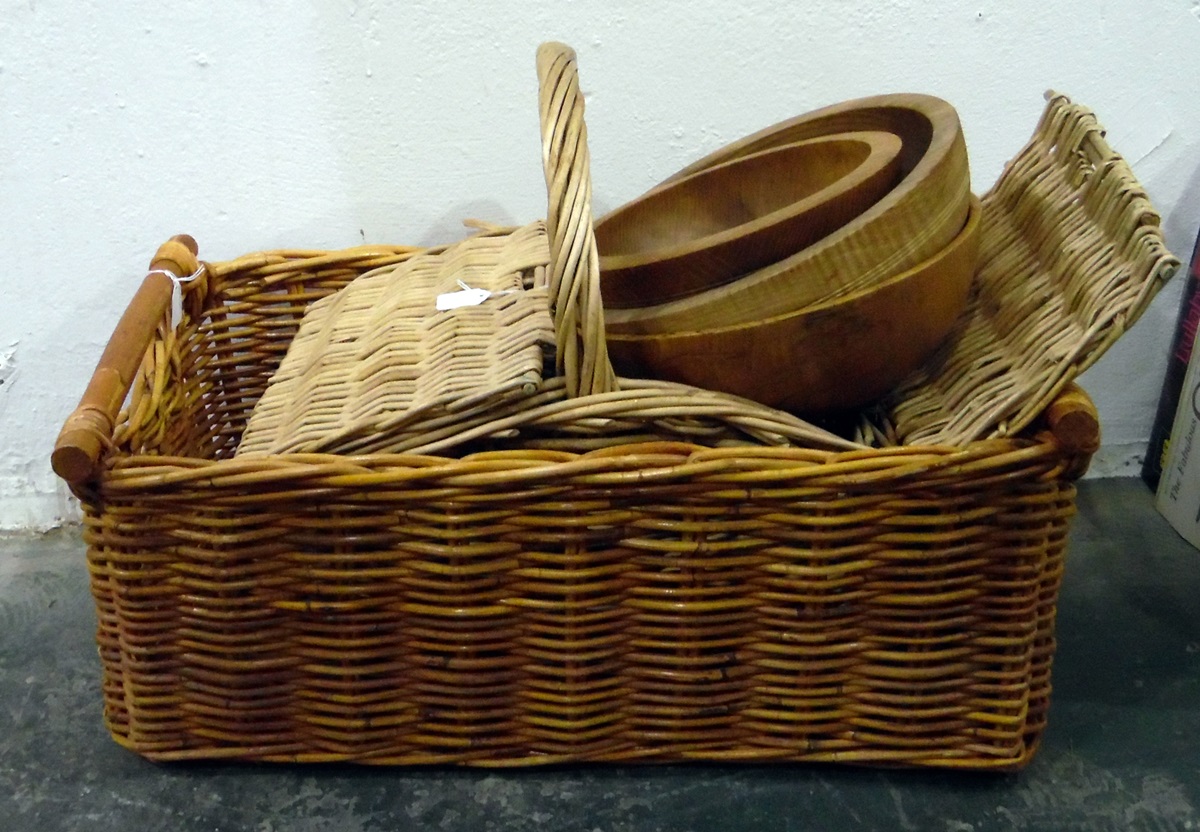 Quantity of turned wooden salad and serving bowls,  picnic basket and another basket