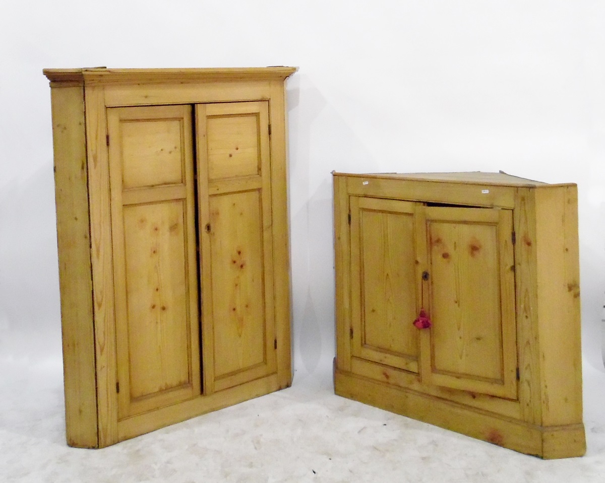 19th century pine standing corner cupboard in two sections, the upper section with flat moulded