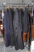 Two vintage gentlemens' overcoats, an academic gown made by W Northam, State Law & University,
