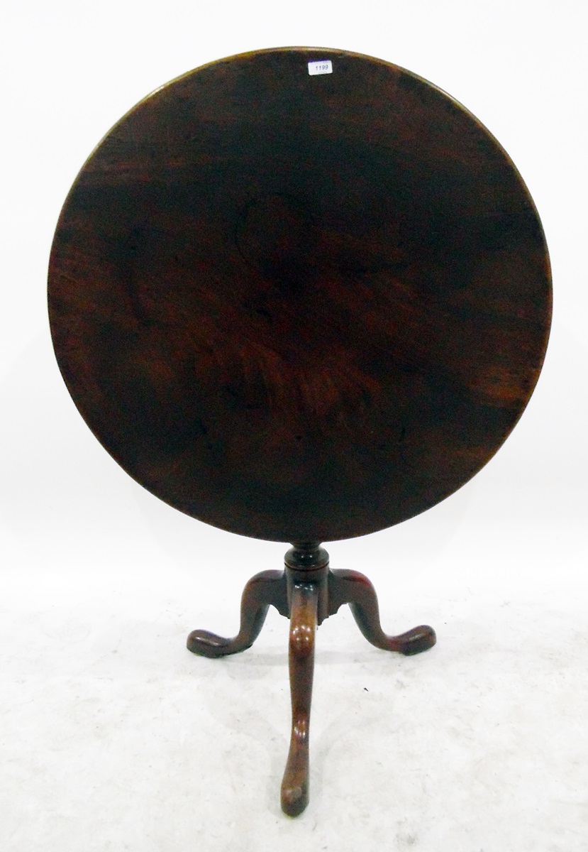19th century circular mahogany tilt top table on turned tripod shaped supports, the one piece top