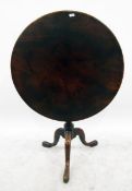 19th century circular mahogany tilt top table on turned tripod shaped supports, the one piece top