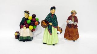 LOT WITHDRAWN - Royal Doulton figures 'Old Balloon Seller' and 'The Orange Lady' and a later model